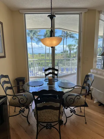 a work room with furniture and a chandelier