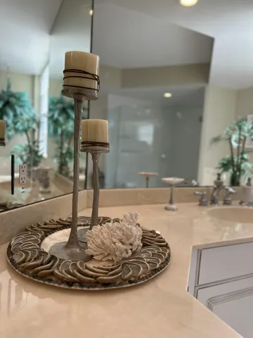 a room with a sink and a mirror