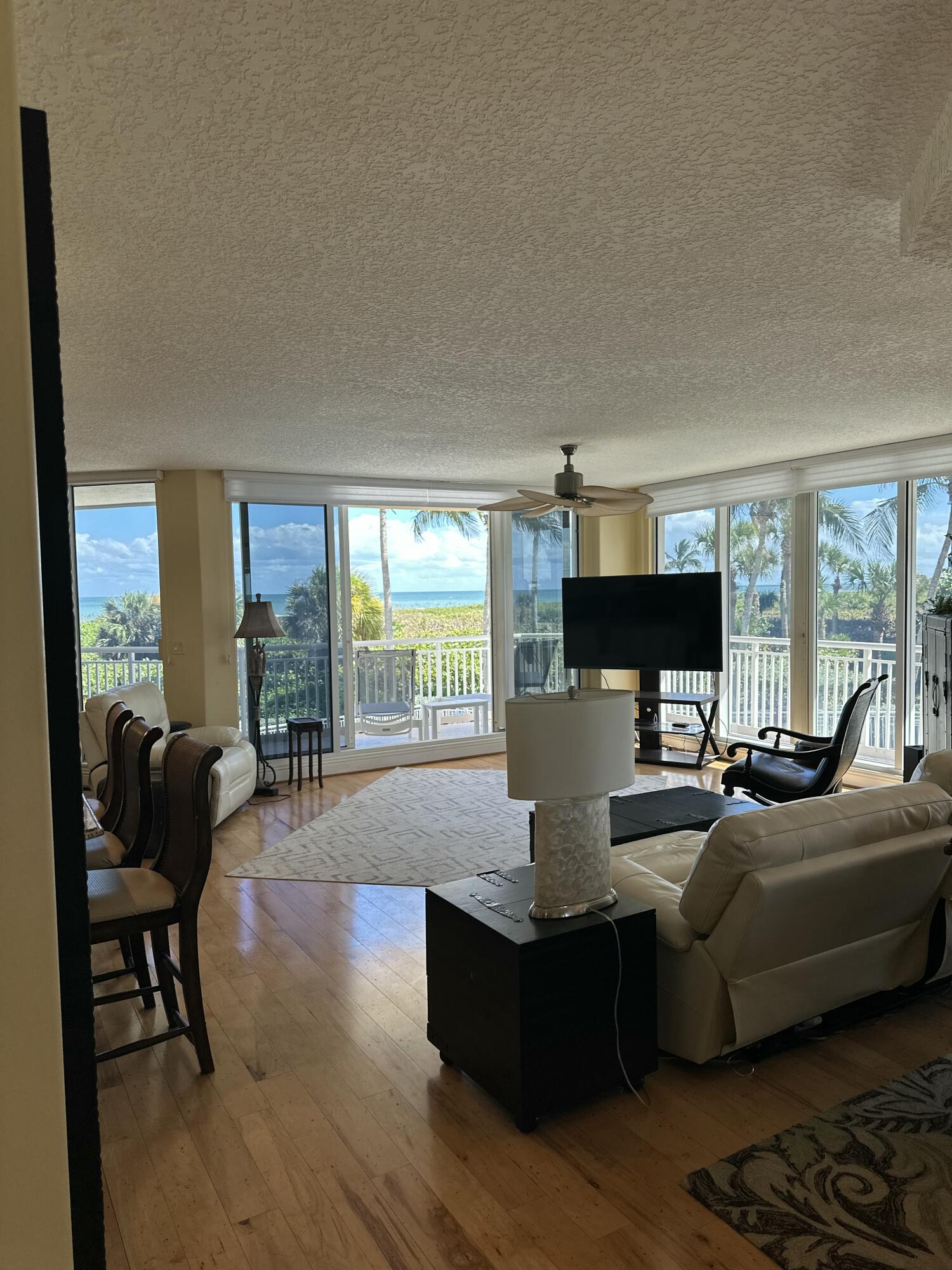 2900 North Hwy A1A, Unit 2 Fort Pierce, FL 34949 - Photo 30 of 34 a living room with furniture fireplace and a large window