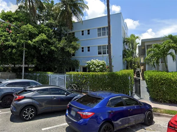 a view of a cars parked in front of a house
