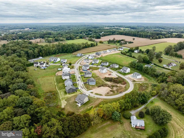 an aerial view of a house with outdoor space