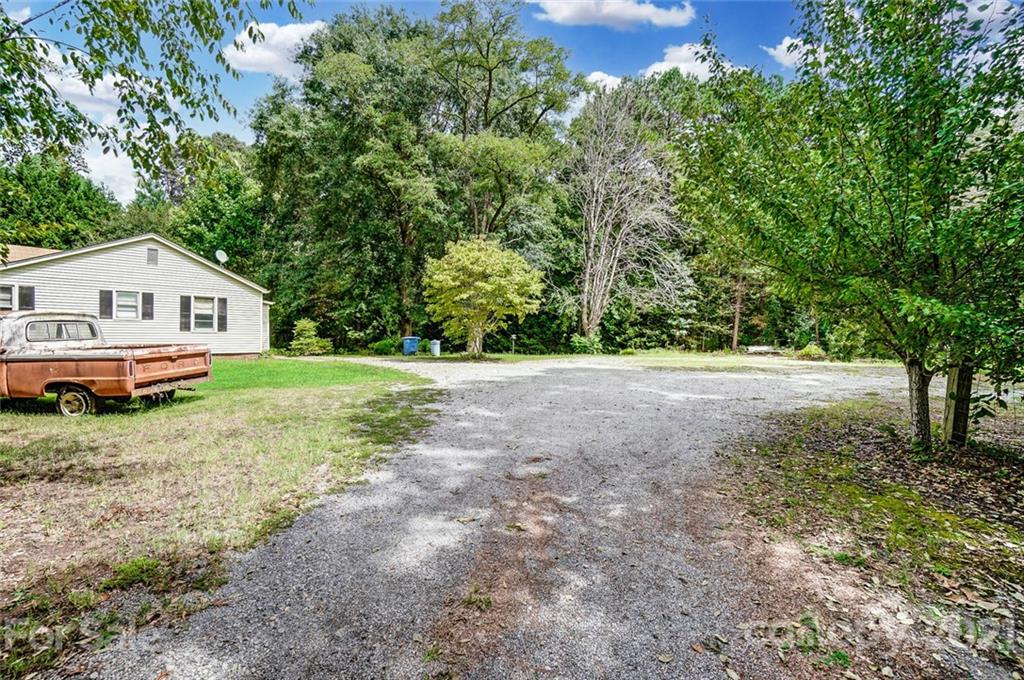 1429 Beth Haven Church Road Denver, NC 28037 - Photo 26 of 27 a view of house with backyard and tall trees