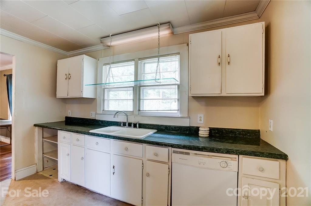 1429 Beth Haven Church Road Denver, NC 28037 - Photo 8 of 27 a kitchen with granite countertop a sink window and cabinets