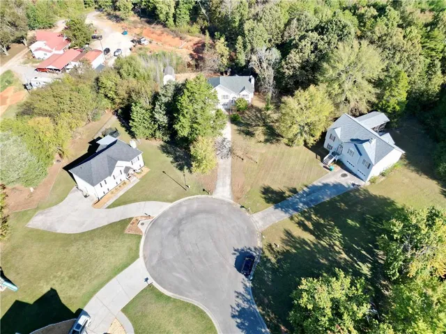 an aerial view of a house with swimming pool