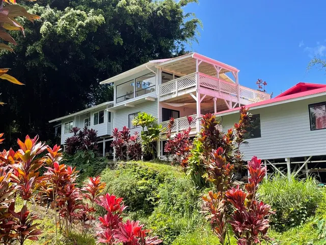 a view of a chairs and table in a garden