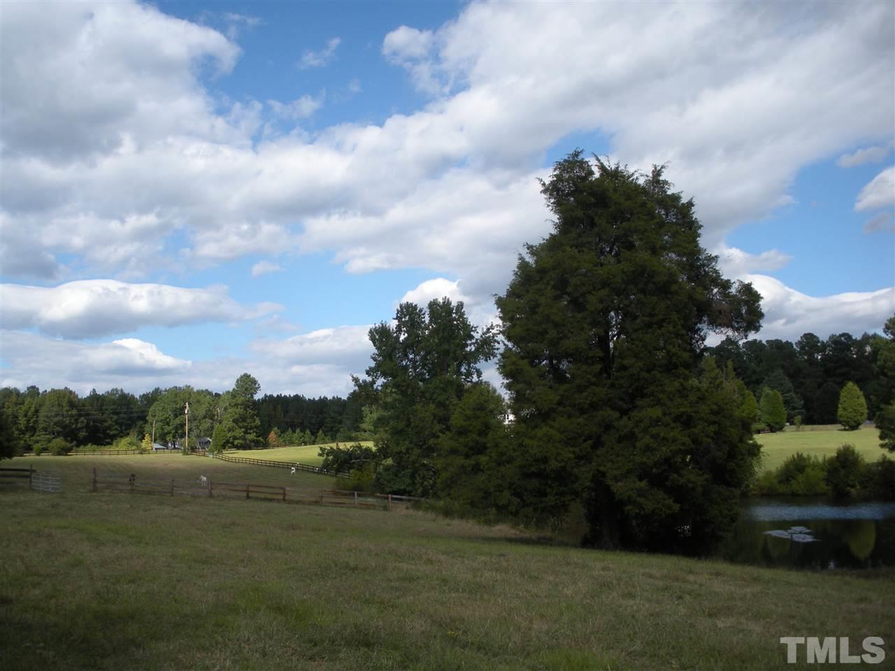 a view of lake with green space