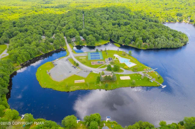 a view of a swimming pool with an outdoor space and seating area