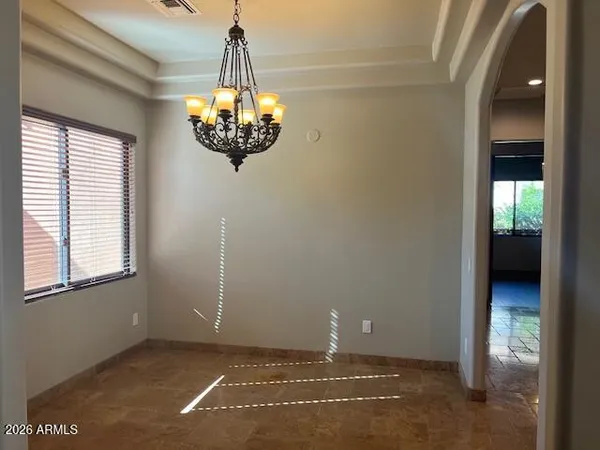 a spacious bathroom with a granite countertop sink and a mirror