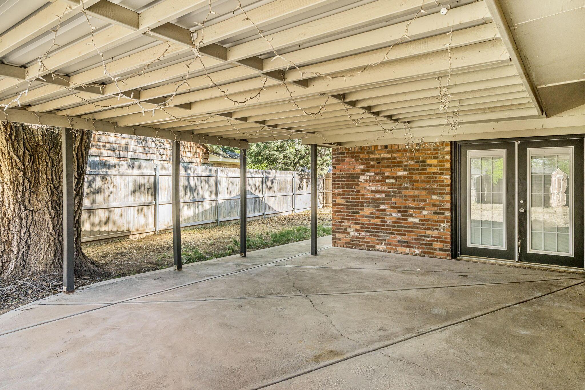 5305 Randolph Road Amarillo, TX 79106 - Photo 16 of 20 a view of an empty room with windows