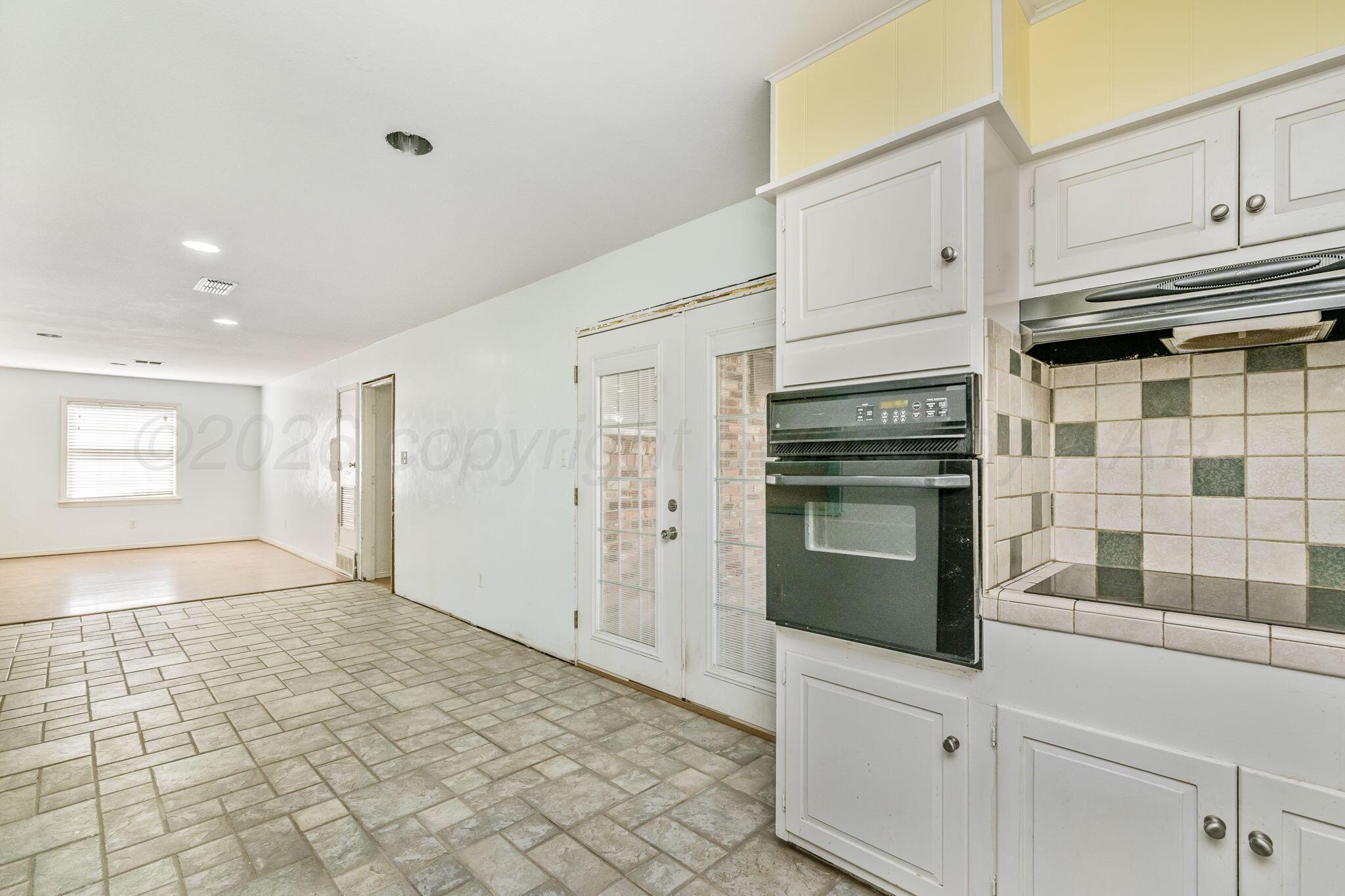 5305 Randolph Road Amarillo, TX 79106 - Photo 8 of 20 a view of a refrigerator and window in the kitchen