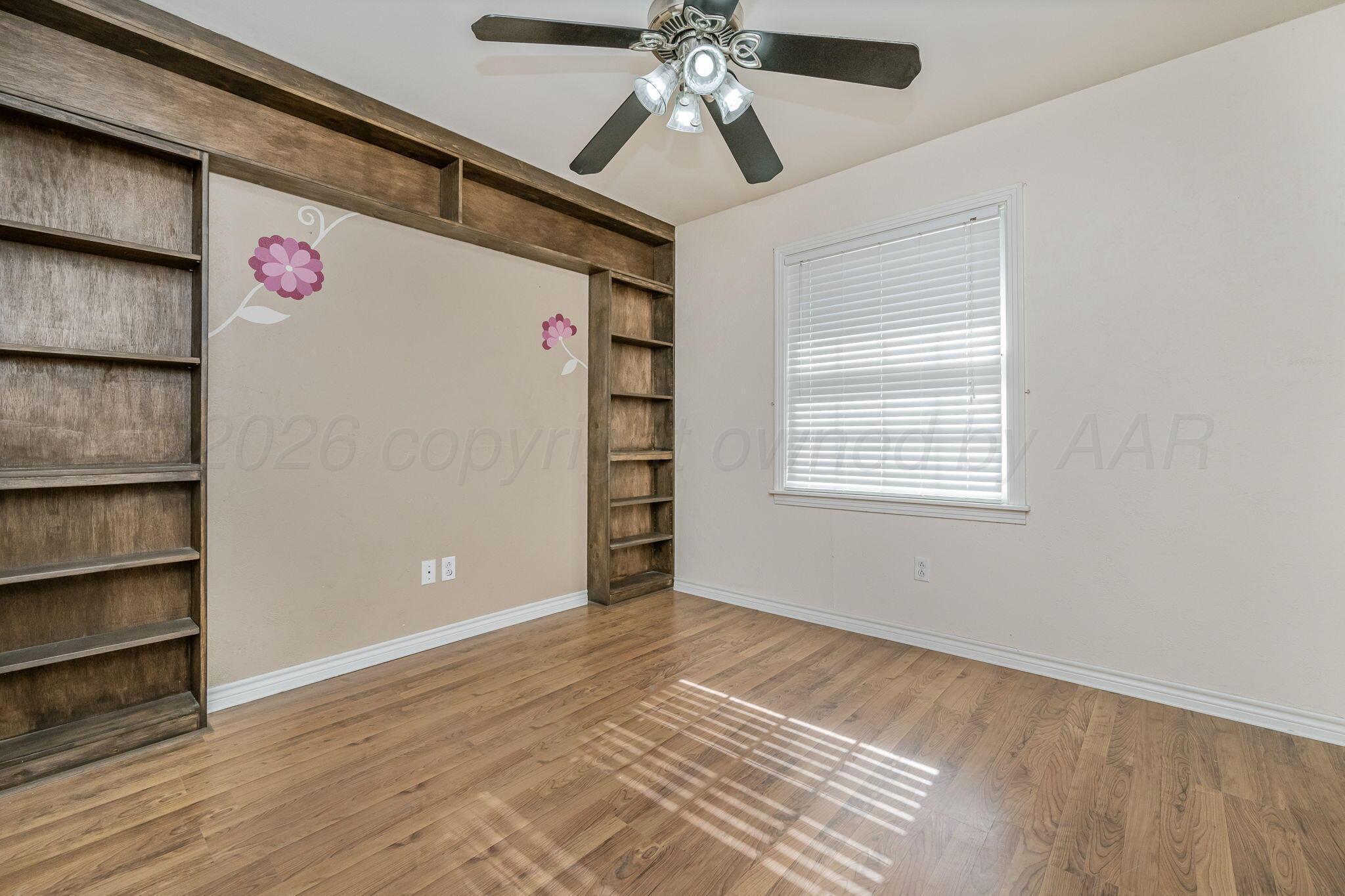 5305 Randolph Road Amarillo, TX 79106 - Photo 10 of 20 a view of an empty room with a window