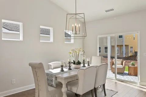a living room with furniture fireplace and flat screen tv