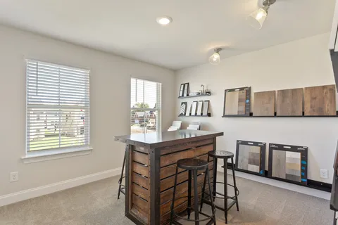 a view of a kitchen with furniture and window