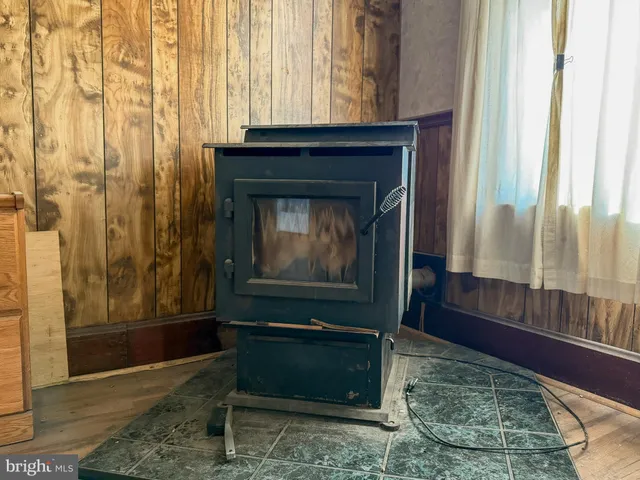 a view of a livingroom with furniture and a fireplace