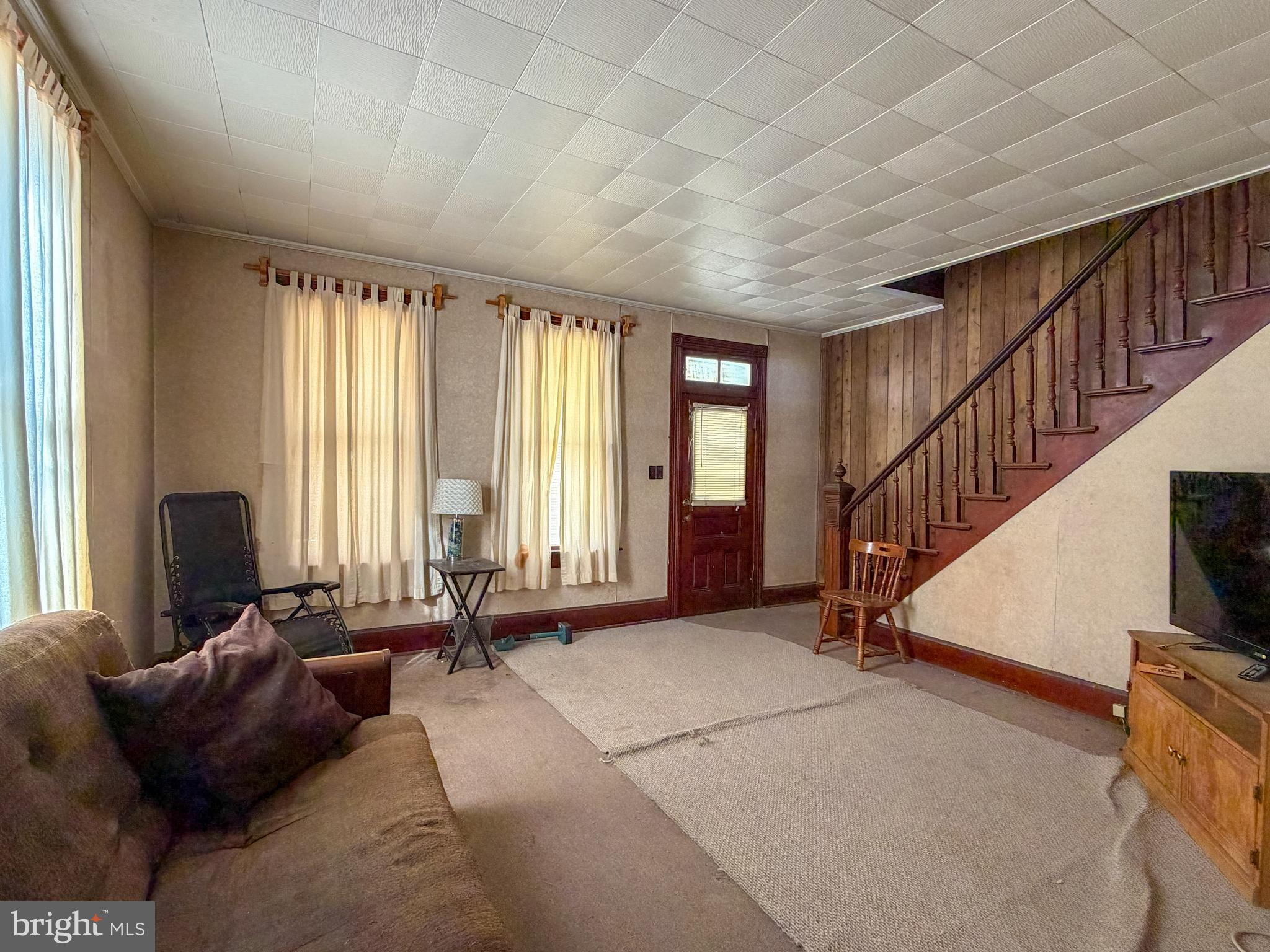 130 East 1st Street Everett, PA 15537 - Photo 15 of 39 a living room with furniture and a window