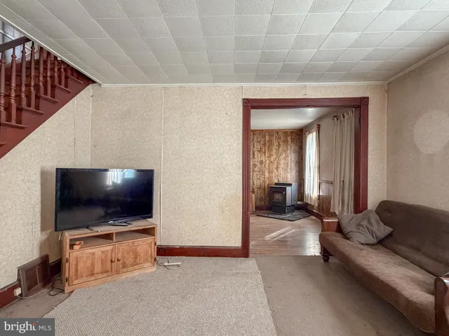 a bedroom with a bed and a mirror