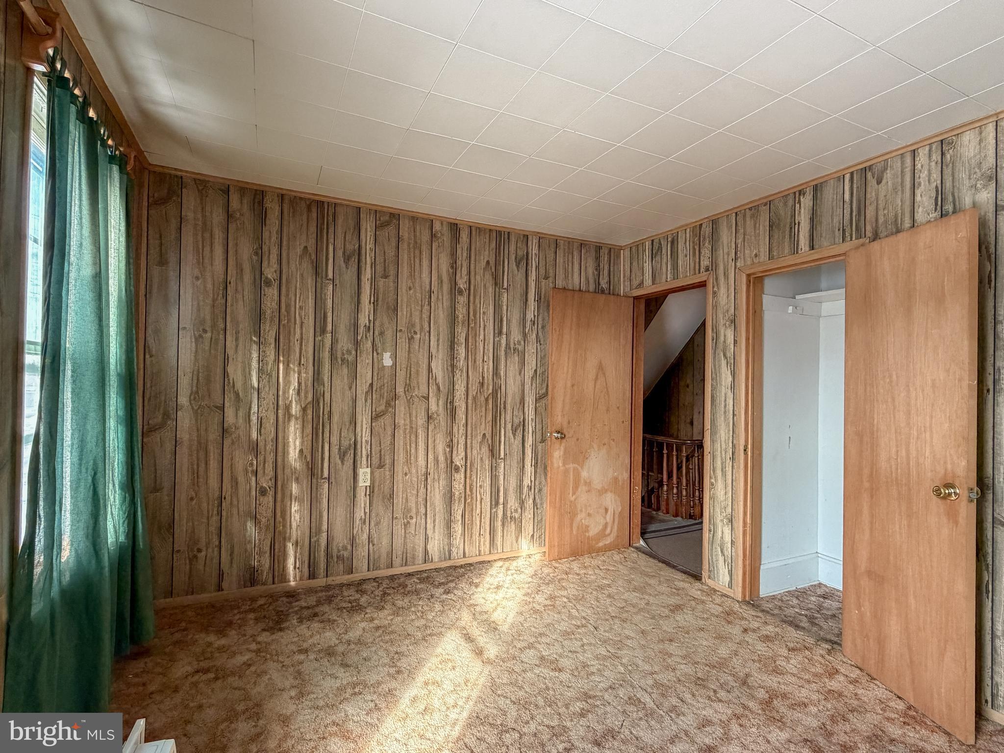 130 East 1st Street Everett, PA 15537 - Photo 24 of 39 a view of entryway with wooden walls