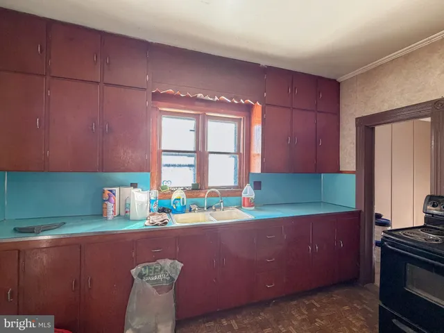 a living room with a fireplace and a glass door shower