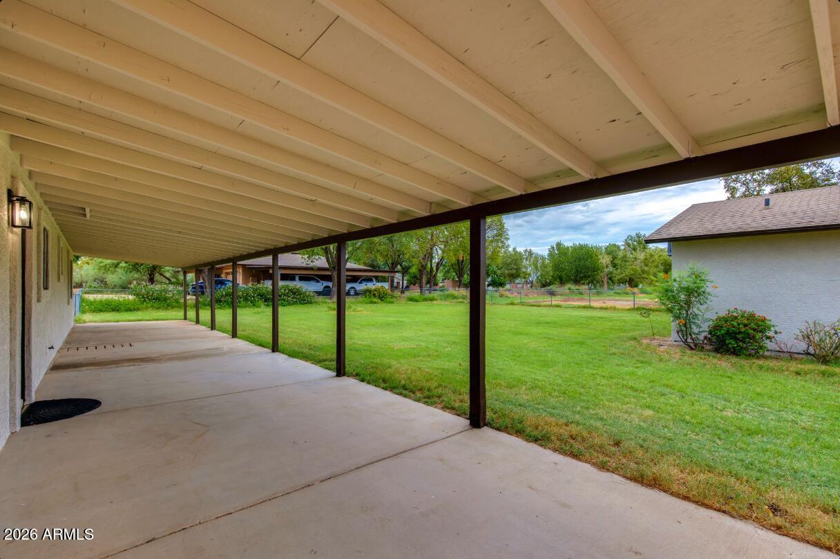 7101 North Perryville Road Waddell, AZ 85355 - Photo 62 of 66 7101 N Perryville covered patio backside