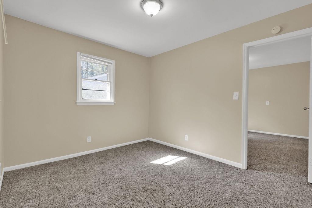 2739 Council Street Lithonia, GA 30058 - Photo 24 of 31 an empty room with a empty space and window