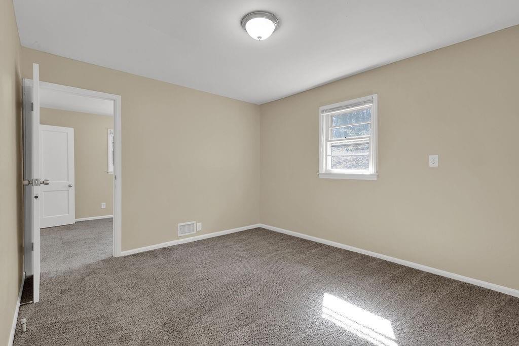 2739 Council Street Lithonia, GA 30058 - Photo 27 of 31 an empty room with a empty space and windows