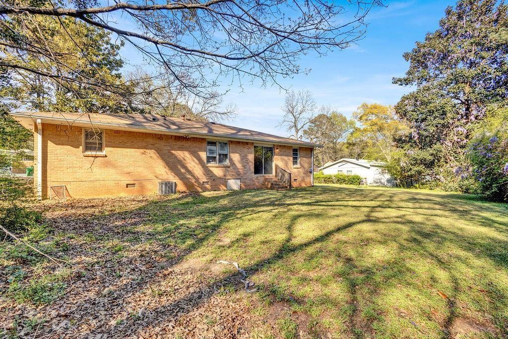 2739 Council Street Lithonia, GA 30058 - Photo 30 of 31 a view of a house with a yard