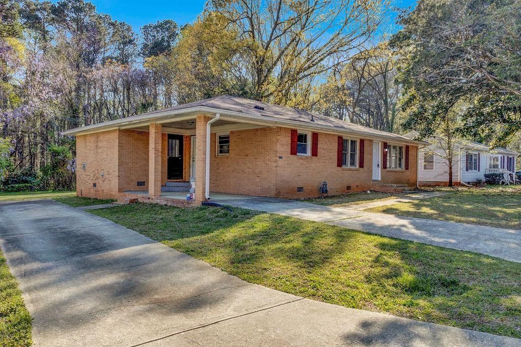 2739 Council Street Lithonia, GA 30058 - Photo 3 of 31 a front view of house with yard and trees around