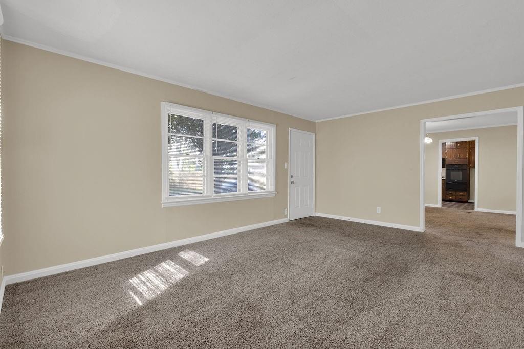 2739 Council Street Lithonia, GA 30058 - Photo 6 of 31 an empty room with windows