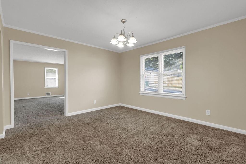 2739 Council Street Lithonia, GA 30058 - Photo 7 of 31 a view of an empty room with a window