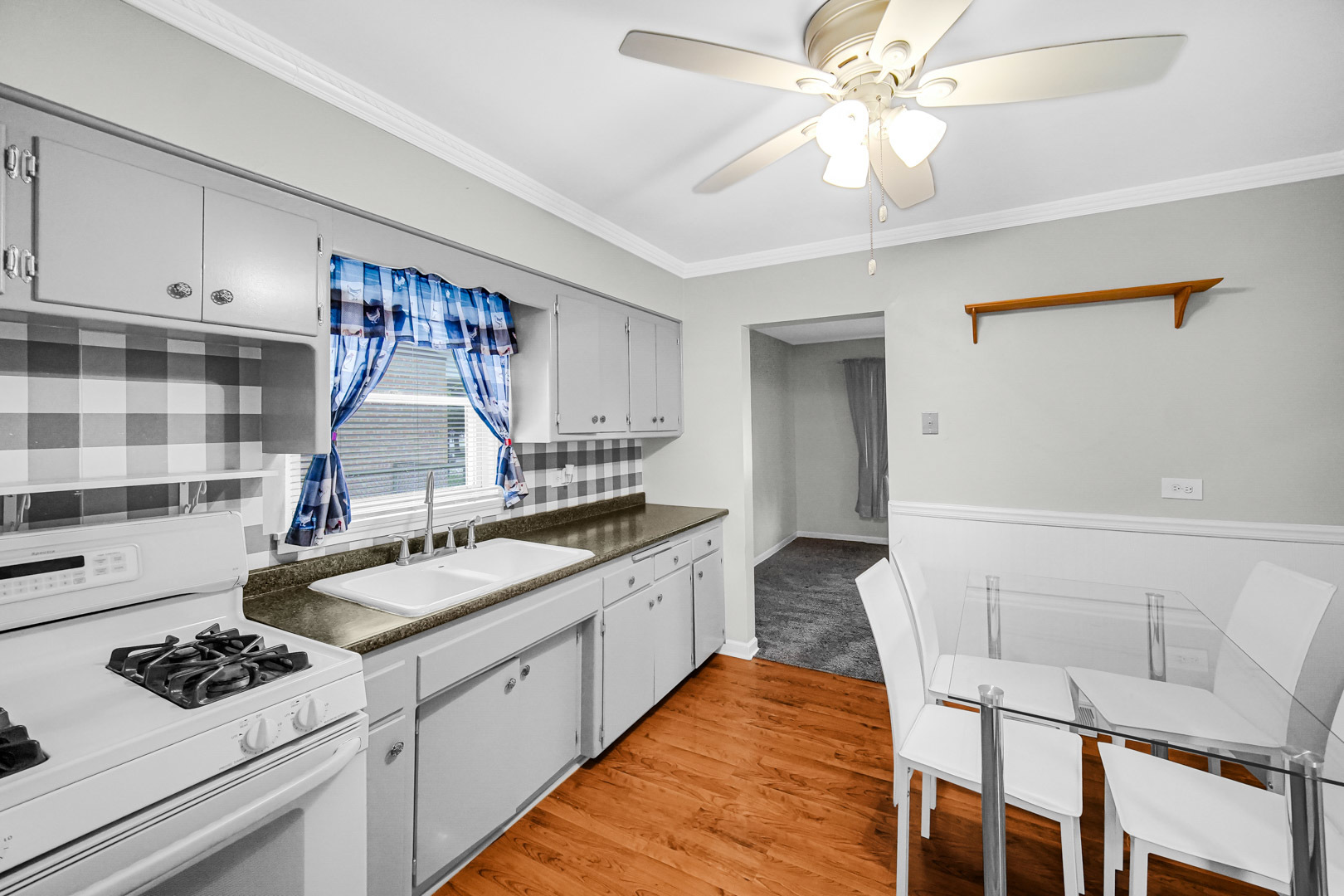11025 Princess Avenue Chicago Ridge, IL 60415 - Photo 11 of 21 a kitchen with a stove a sink and a refrigerator
