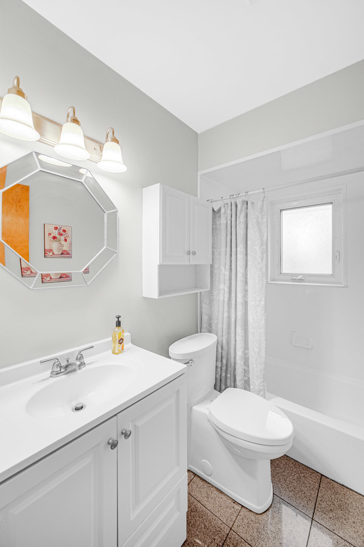 11025 Princess Avenue Chicago Ridge, IL 60415 - Photo 15 of 21 a bathroom with a sink a toilet and a shower