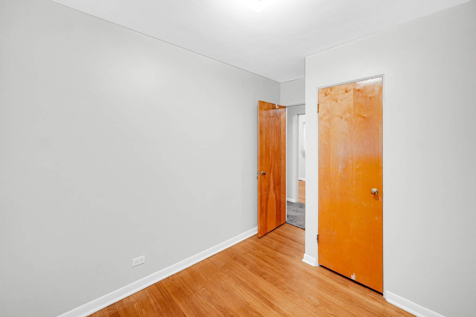 11025 Princess Avenue Chicago Ridge, IL 60415 - Photo 17 of 21 a view of an empty room with wooden floor and a window