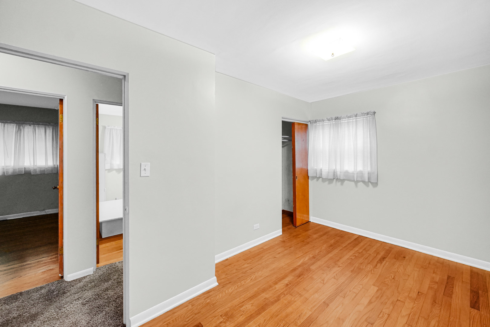 11025 Princess Avenue Chicago Ridge, IL 60415 - Photo 18 of 21 an empty room with wooden floor and windows