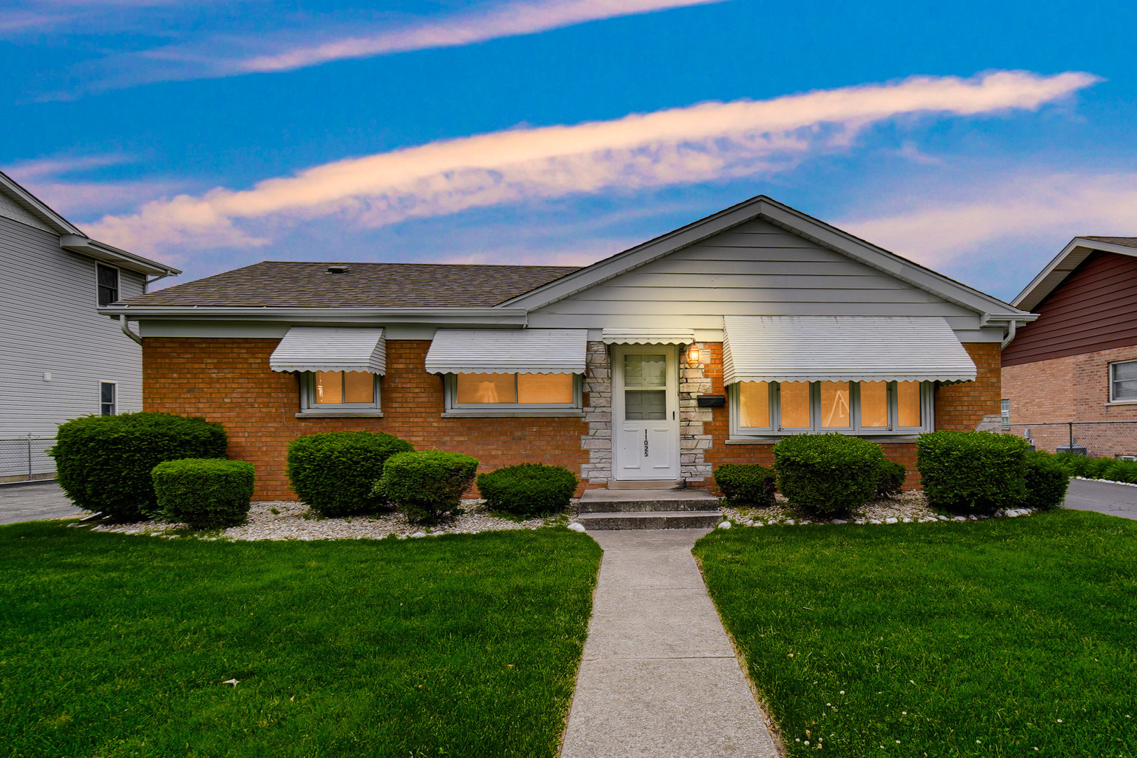 11025 Princess Avenue Chicago Ridge, IL 60415 - Photo 2 of 21 a front view of a house with a yard