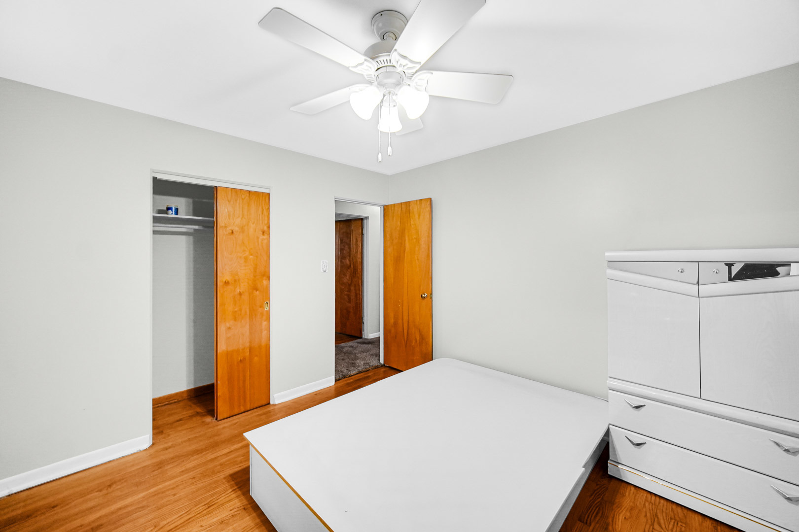 11025 Princess Avenue Chicago Ridge, IL 60415 - Photo 21 of 21 a bedroom with a bed and a chandelier