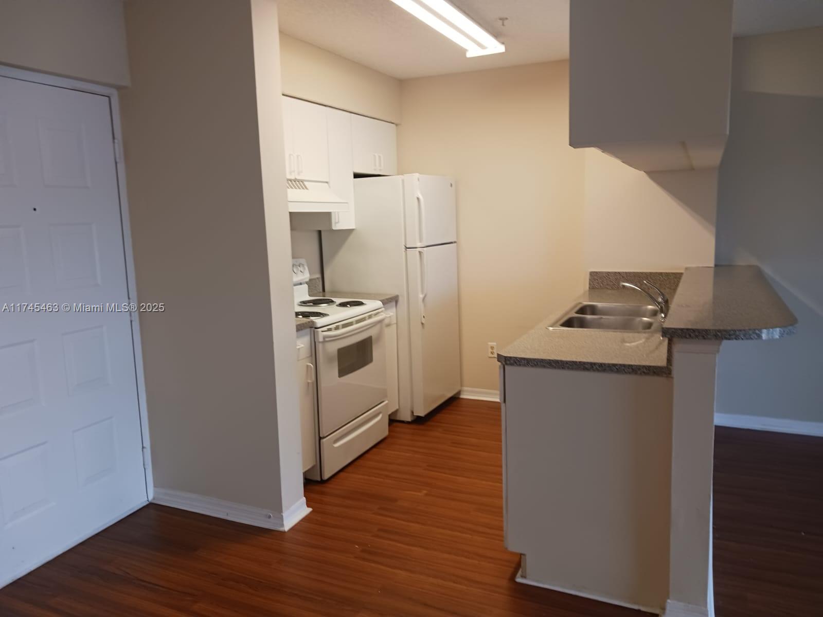 Pinehurst Club Condominiums Hollywood, FL 33021 - Photo 17 of 22 a storage room with wooden floor