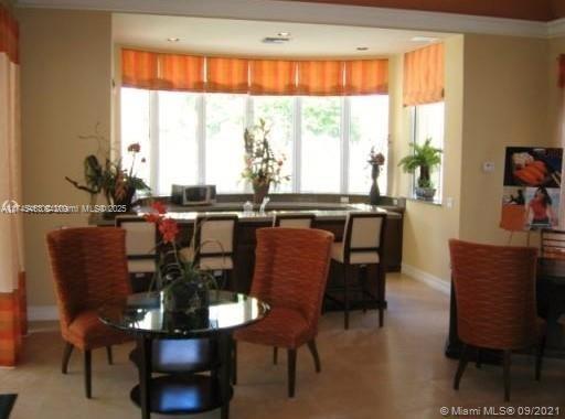 Pinehurst Club Condominiums Hollywood, FL 33021 - Photo 5 of 22 a view of a dining room with furniture and window