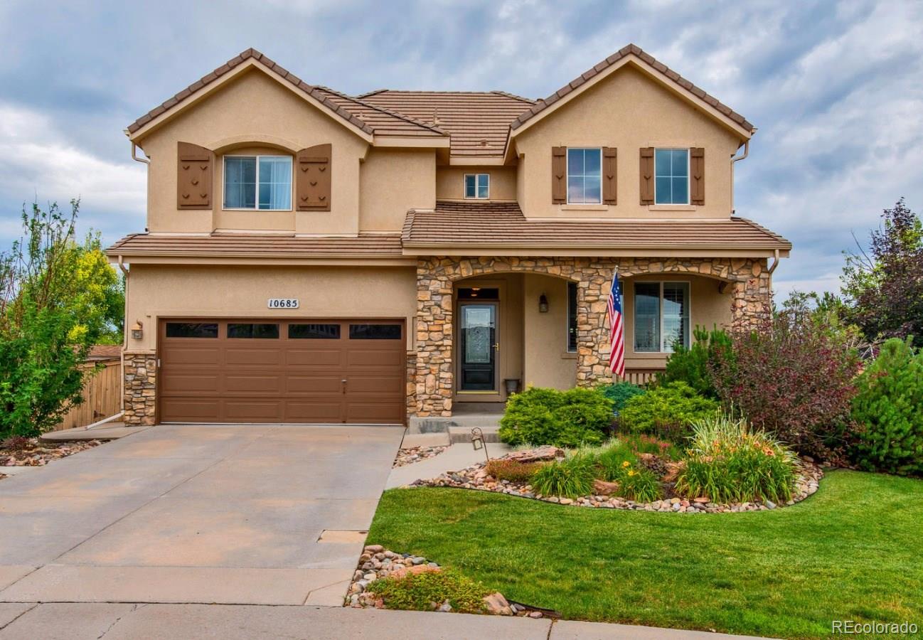 10685 Wynspire Road Highlands Ranch, CO 80130 - Photo 1 of 29 front view of house with a yard