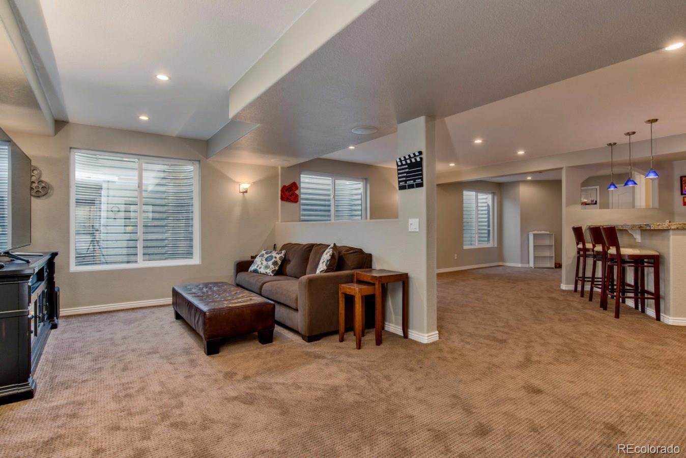 10685 Wynspire Road Highlands Ranch, CO 80130 - Photo 15 of 29 a living room with furniture and a window