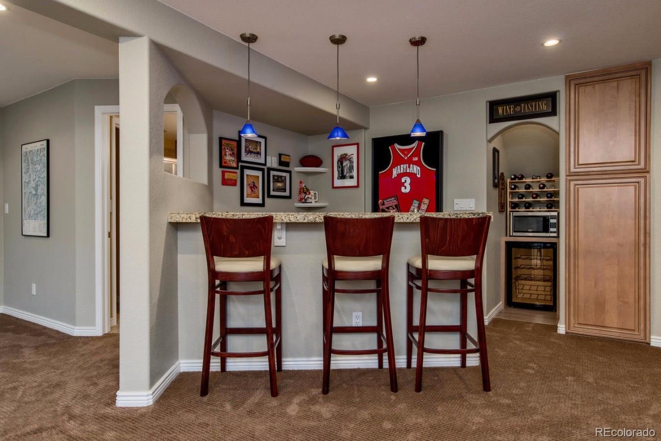 10685 Wynspire Road Highlands Ranch, CO 80130 - Photo 17 of 29 a view of a chairs in a kitchen
