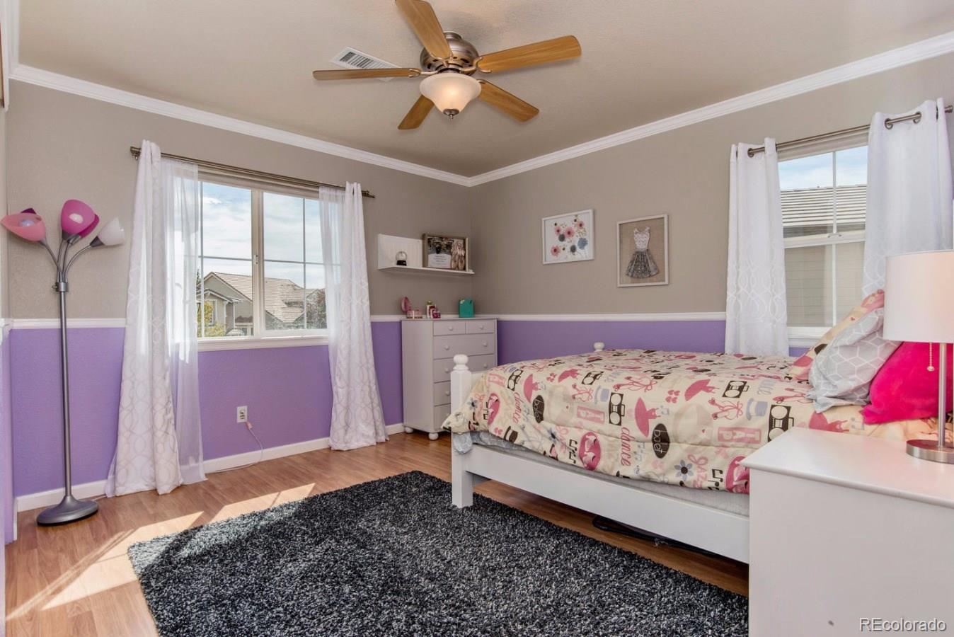 10685 Wynspire Road Highlands Ranch, CO 80130 - Photo 24 of 29 a bedroom with a bed and a window