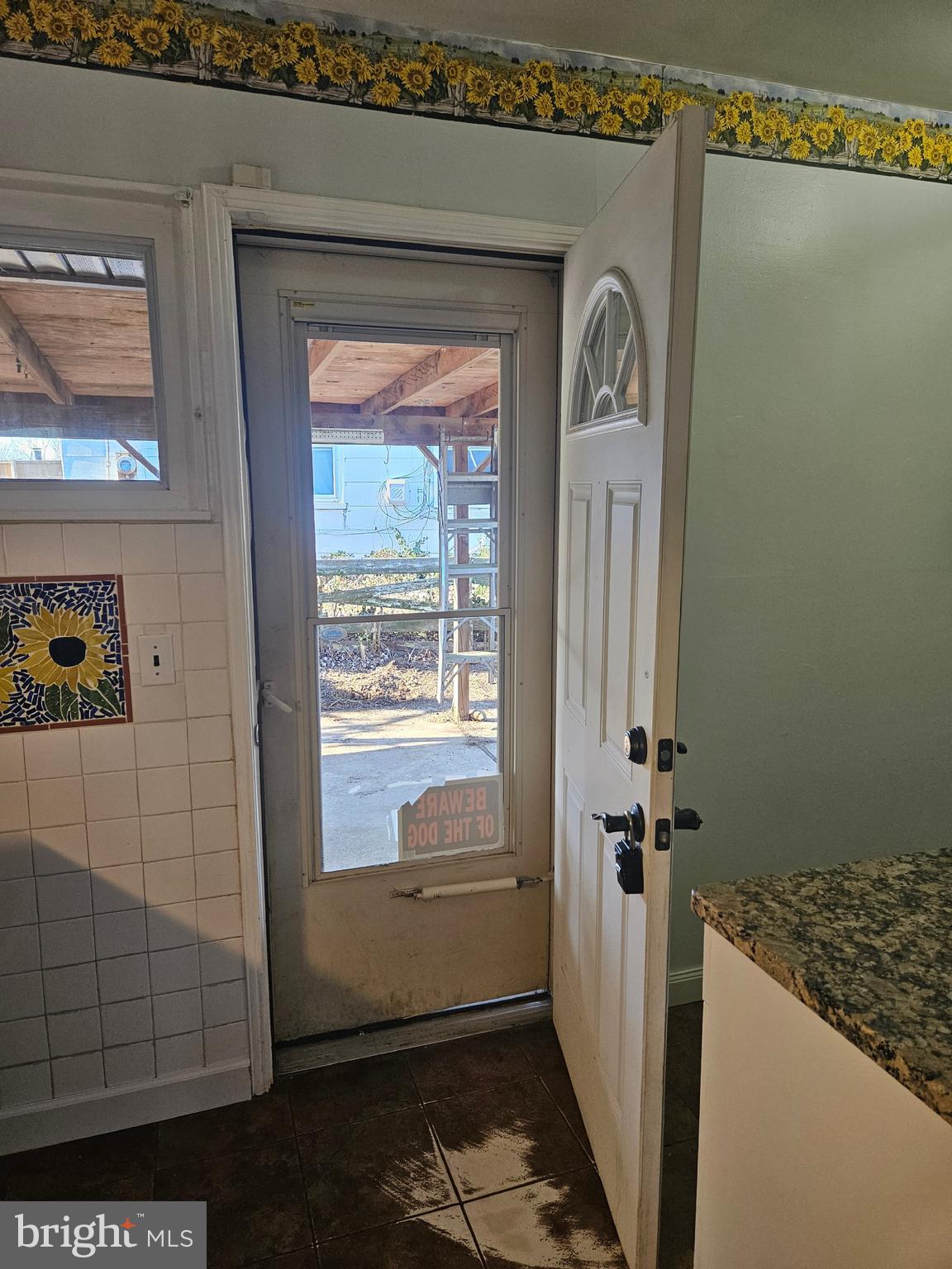 905 Lindsay Road Oxon Hill, MD 20745 - Photo 12 of 31 a view of a door and chair in a room