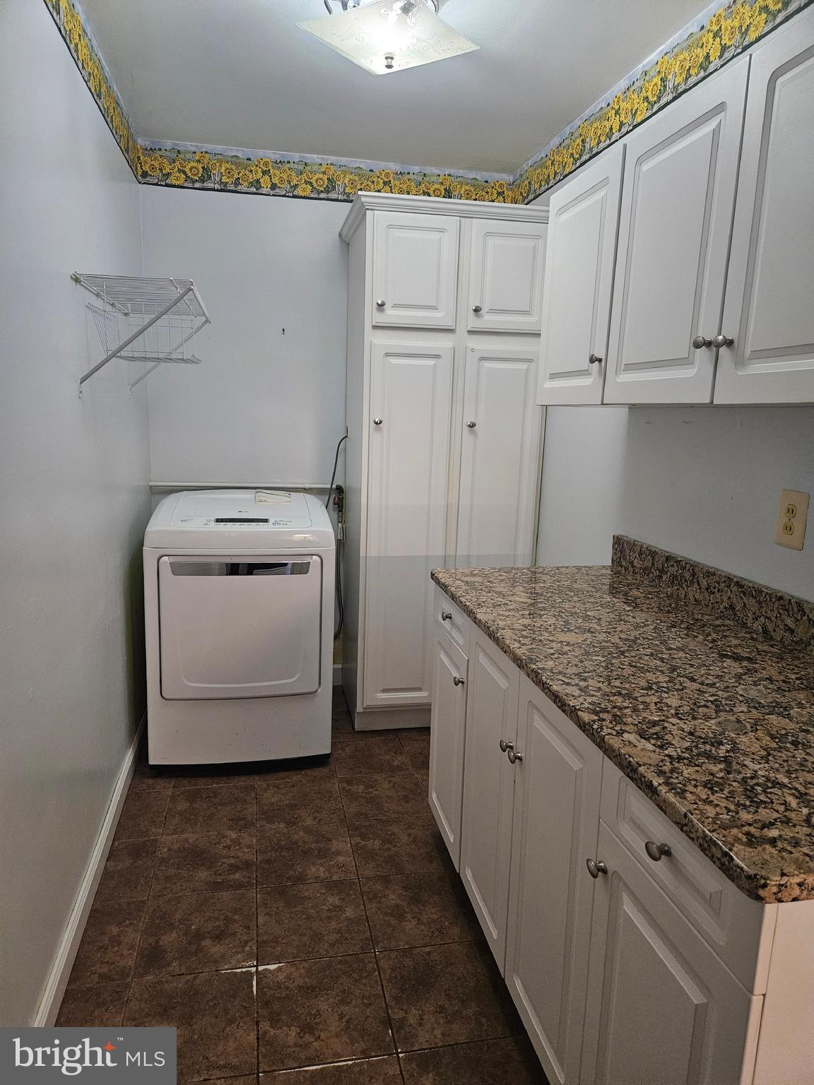 905 Lindsay Road Oxon Hill, MD 20745 - Photo 13 of 31 a utility room with cabinets washer and dryer