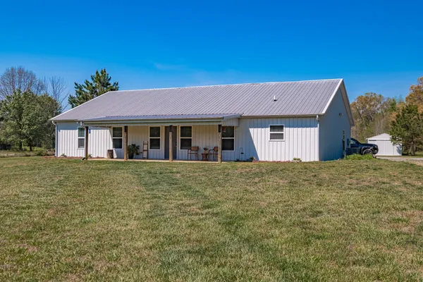 a house with trees in front of it