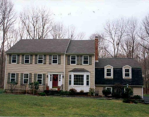 281 Ivy Hill Road Ridgefield, CT 06877 - Photo 1 of 1 a front view of a house with a yard