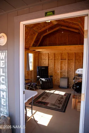 a street view with wooden fence and trees