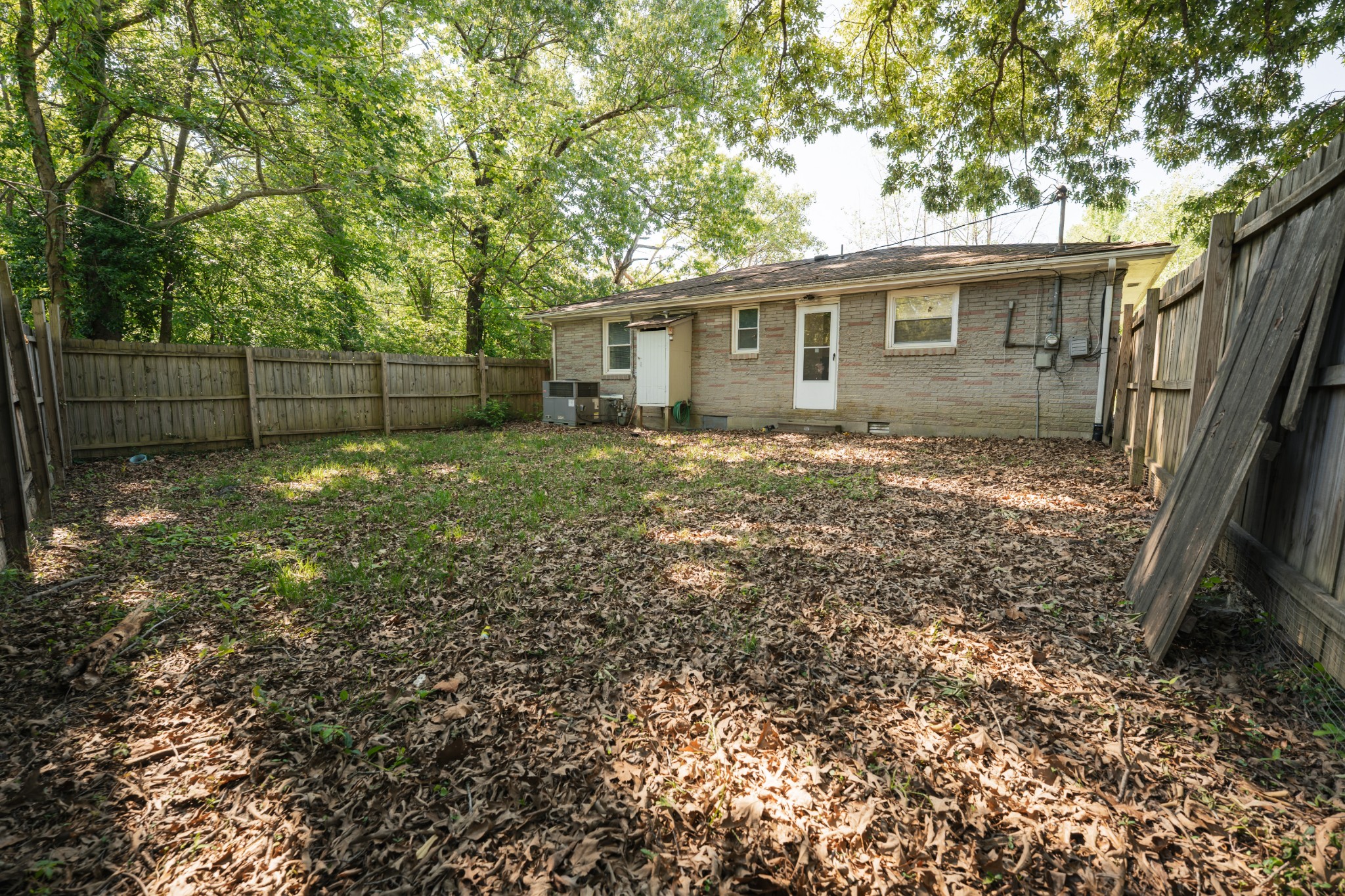8247 Pinewood Road Nunnelly, TN 37137 - Photo 13 of 14 a view of a backyard with a tree