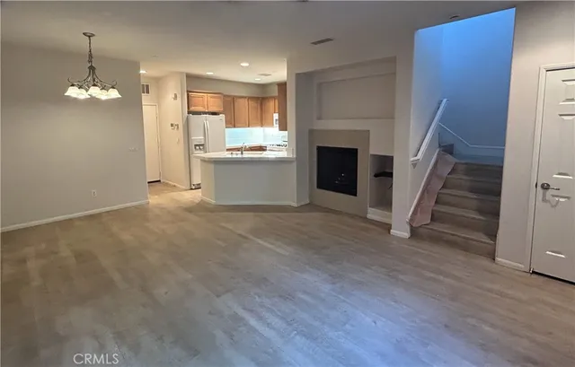a view of a kitchen with a sink cabinet and a window