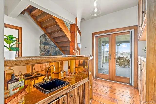 a bathroom with a sink a toilet and mirror