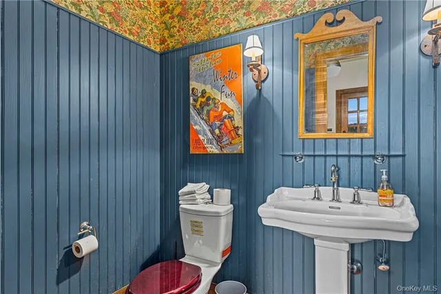 a living room with furniture a fireplace and a window